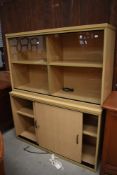 A beech laminate office bookcase with cupboard base