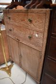 A mid 20th Century limed oak tallboy