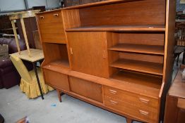 A teak sideboard of stylised design , width approx. 183cm
