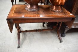 A reproduction Regency style yew wood coffee table