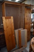A 20th century pine wardrobe three door with two drawers