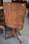 A 19th century mahogany stem table, with rounded rectangular top above a turned column issuing three