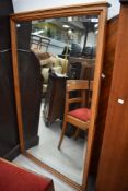 An impressive golden oak wall mirror, originally dressing table or cheval mirror