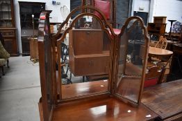 An early 20th Century triptych dressing table mirror having shaped frame