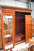 An Edwardian mahogany two piece bedroom suite having inlaid decoration