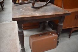 An early 20th century drawer leaf oak table