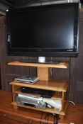 A Philips HD TV, A DVD player and a Cassette player sold with oak unit.