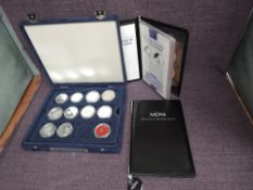 A collection of nine Silver crown sized coins including Ecu's, 1oz Britannia 2008, Five Dollar,