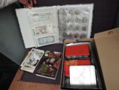 A collection of World Coins and Banknotes in album and loose along with a 2014 Coin Year Book