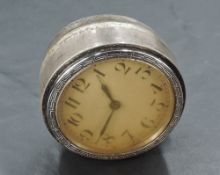 A Silver mounted 1930's clock, with Meandros border, bearing lion passant and date letter F, 5.