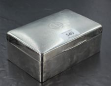 A George V silver cigarette box, of hinged rectangular form with hinged rectangular form with