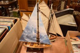 Two modern model Sail Boats, one named Thonier, both on stands