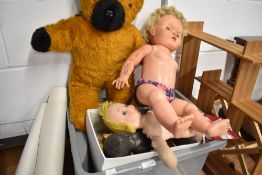 A selection of vintage and retro dolls, teddies and wooden dolls house furniture.