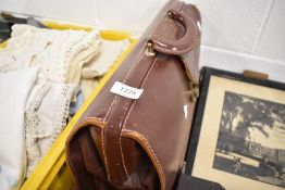 A leather bound satchel or bag
