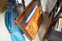 A wooden plaque and two prints