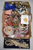 A tray of beads, necklaces etc