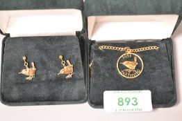 Two pieces of yellow metal jewellery including necklace and ear rings with Wren decoration