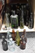 A collection of vintage bottles including those of interest to Carlisle, Kendal, Barrow in