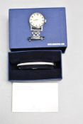 A Swarovski crystal set hinged bangle and a vintage nurse's watch