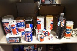 An assortment of retro Pepsi collectables to include Radio, money boxes and telephone.