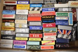 A box full of souvenir playing cards, including Guinness, Transport interest and London