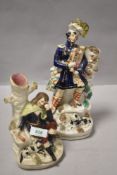 Two Victorian Staffordshire flat back figures one of highlander with pipes and similar sat with cat