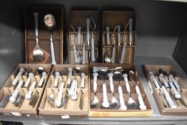 Seven cases of Denby Regency blue handle cutlery and flatwares