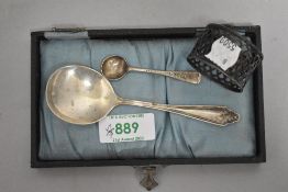 Three items of HM silver including two spoons and a pierced napkin ring