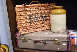 A 20th century suitcase with Fortnum and Masons hamper and a large salt glazed storage jar