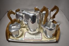 An early 20th century Picquot tea set complete with tray and tea pot