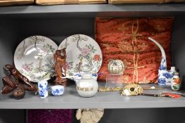 A selection of Chinese oriental ceramics and decorations including ginger jar, opium pipe, and