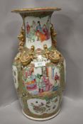 A Qing dynasty floor vase in famille rose having 10 decorated panels of an official visit and
