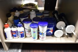 A shelf full of collectable retro Pepsi drinks bottles.