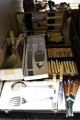 A mixed selection of flat wear including boxed fish serving set, bone handled forks, and knives