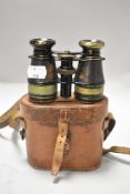 A pair of early 20th century binoculars marked Cyclist with fitted case