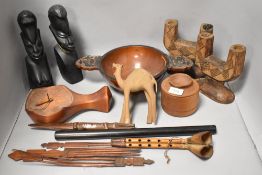 A mixed lot of treen including rustic carved candle sticks, bowl, two carved busts and more.