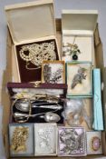 A box of costume broaches, necklaces, plates flatware, etc