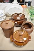 Four vintage earthen ware storage jars and tureens.