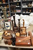 A selection of treen amongst which are a carved box, large candle stick holder and smaller early