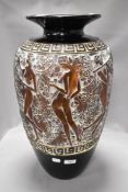 A modern floor vase having classical nude ladies and flowers in moulded resin with Greek key