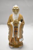 A 20th century Chinese Mudman figure of a monk or similar