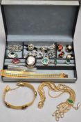A jewellery box containing a good selection of vintage costume rings, broaches, clip on earrings,