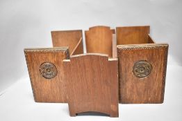 Three early 20th century book shelf or troughs all made in oak including a matching pair having
