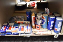 An assortment of retro Pepsi collectables to include pencil cases and tins, ruler sets and more.