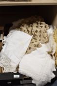 A box of vintage textiles to include huckaback towel, tray clothes, crotched mats and other items.