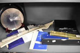 20th century stationary and map reading items including slide rule and geometry set