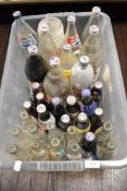 A box of vintage and retro Pepsi bottles, some still having contents!
