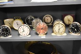 20th century large collection of alarm clocks most having metal cases including names Smiths,
