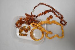 A selection of Baltic amber jewellery including necklaces, brooches, bracelet and clip earrings