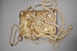 A box of pearl style necklaces